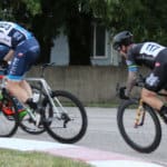 cyclists standing pedaling