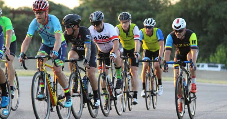 group of cyclists riding