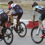cyclists standing out of corners