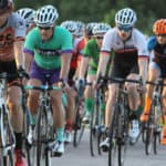 cyclists riding in a group on a fast ride