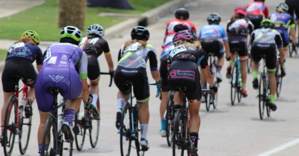 road cyclists riding away