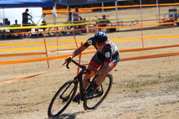 woman cyclocross racer cornering
