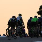 cyclists at dusk
