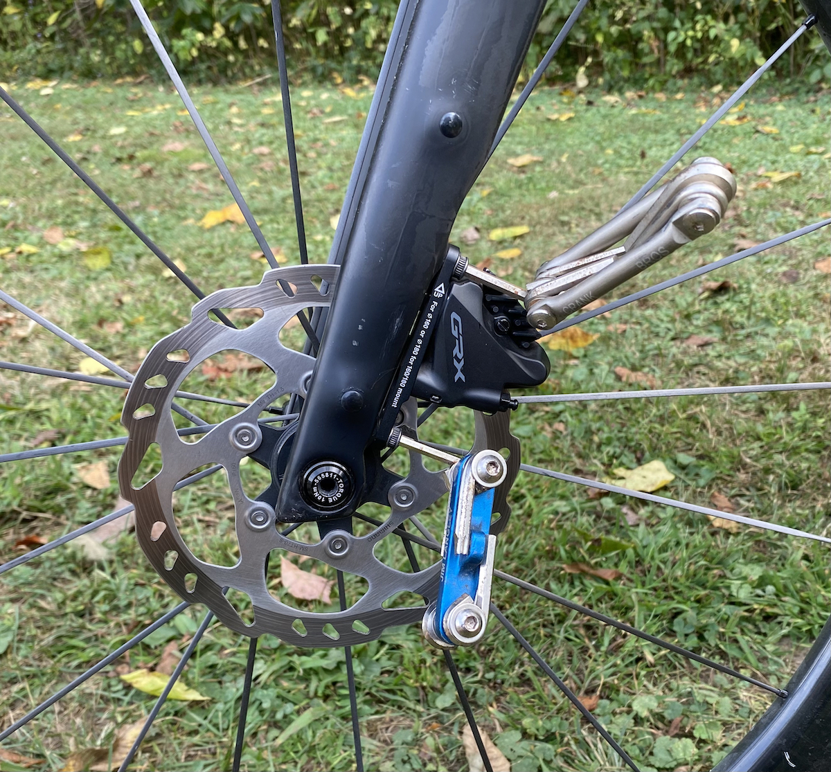 multitool to adjust bike disc brakes