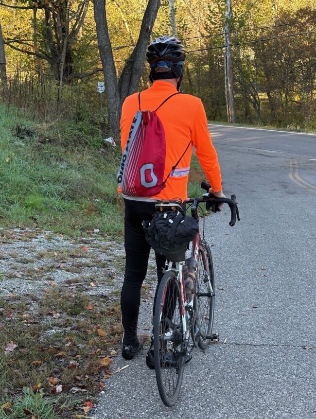 cyclist with drawstring bag